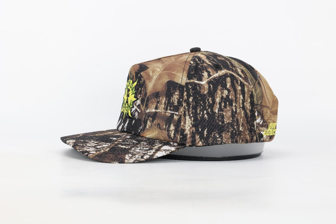 EACH DAY IS A BLESSING™ CAMO TRUCKER HAT (LEFT SIDE) BY OUR AGENCY OY